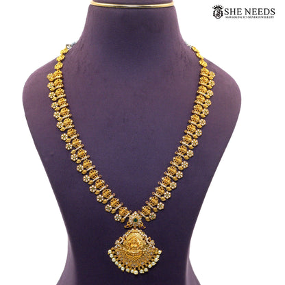 Long antique necklace with Lakshmi pendant, ruby accents, green stones and pearl drops|She Needs Jewellery
