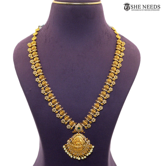 Long antique necklace with Lakshmi pendant, ruby accents, green stones and pearl drops|She Needs Jewellery
