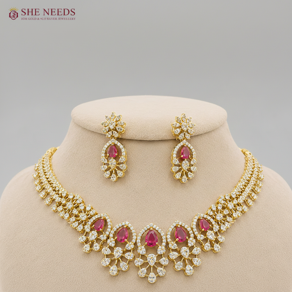 Elegant ruby pink American diamond stone floral bridal necklace set with matching earrings displayed on white mannequin for wedding and festive wear.