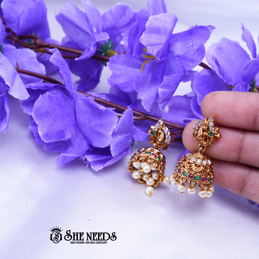 Temple nakshi jhumka earrings with CZ stones and intricate detailing with bead danglings for traditional wear