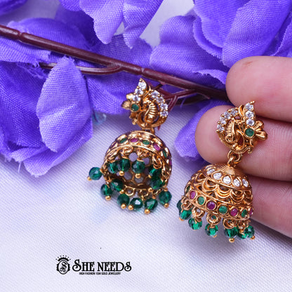 Temple nakshi jhumka earrings with CZ stones and intricate detailing with bead danglings for traditional wear