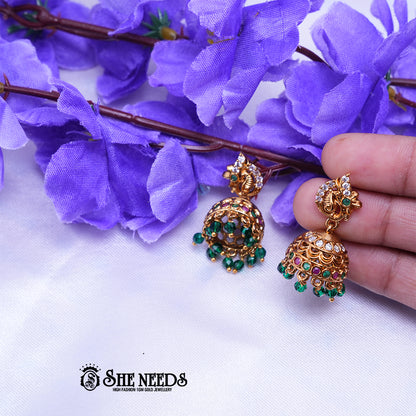 Temple nakshi jhumka earrings with CZ stones and intricate detailing with bead danglings for traditional wear