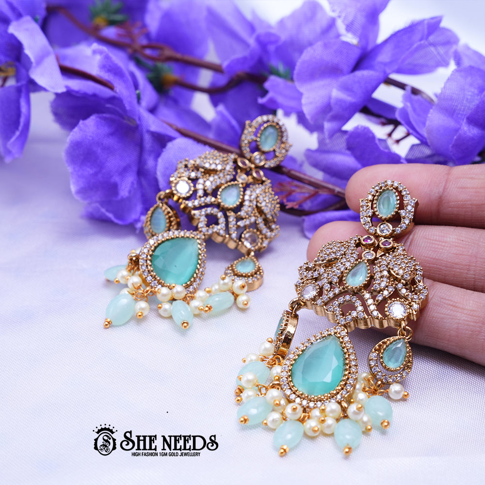 Designer CZ stone chandbali earrings with teardrop stones and pearl bead drops for bridal wear
