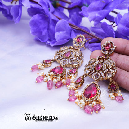 Designer CZ stone chandbali earrings with teardrop stones and pearl bead drops for bridal wear