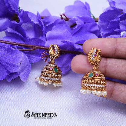 Temple peacock jhumka earrings with CZ stones intricate design and bead danglings for traditional Indian jewellery