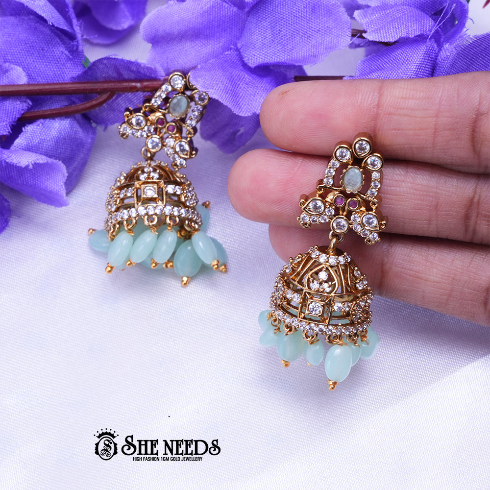 Aarika Antique Gold CZ Stone Jhumka Earrings with Bead Drops | Premium Festive Wear