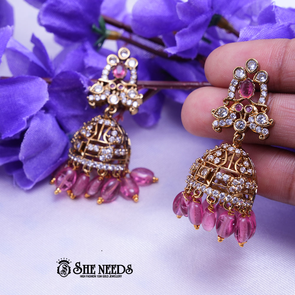 Aarika Antique Gold CZ Stone Jhumka Earrings with Bead Drops | Premium Festive Wear