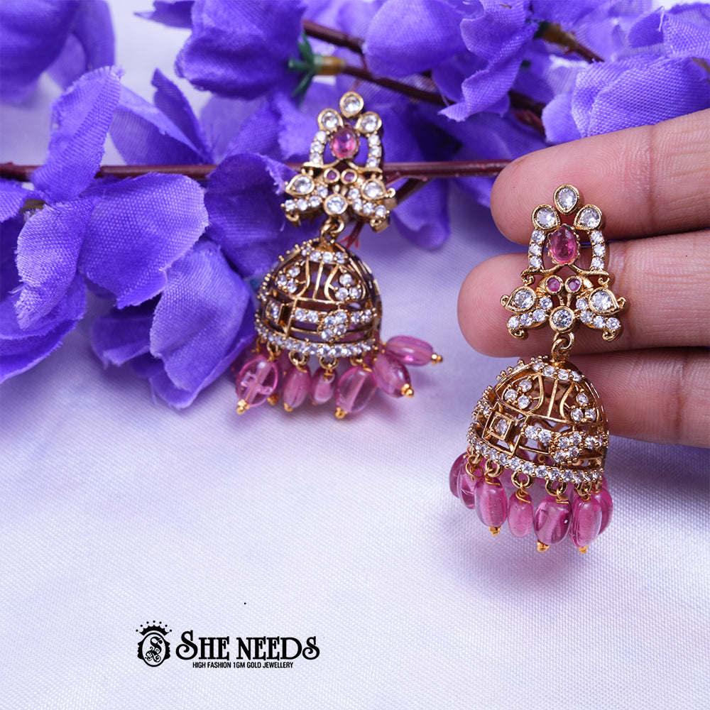 Aarika Antique Gold CZ Stone Jhumka Earrings with Bead Drops | Premium Festive Wear