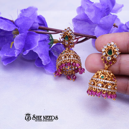Antique gold jhumka earrings with CZ stones and bead drops by She Needs Jewellery
