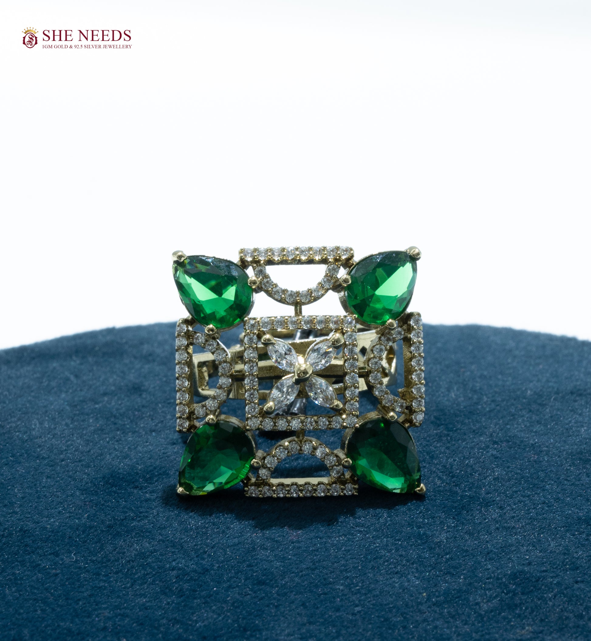 Geometric designer cocktail ring with CZ stones and teardrop green  stones