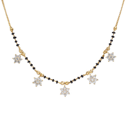 Gold-tone Star Charm Mangalsutra featuring sparkling CZ star-shaped charms, traditional black bead detailing, and a delicate chain design displayed on a jewelry bust.