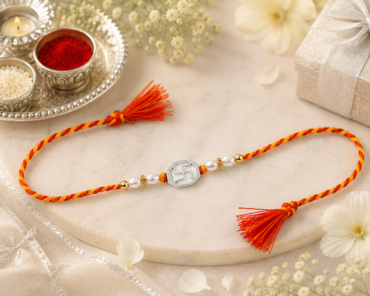 Swastik 925 silver Rakhi with pearl beads, sparkling stones and red-yellow braided thread|She Needs Jewellery
