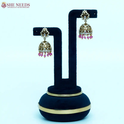 Gold-plated traditional jhumka earrings with light pink bead drops and zircon stones for women|She Needs jewellery
