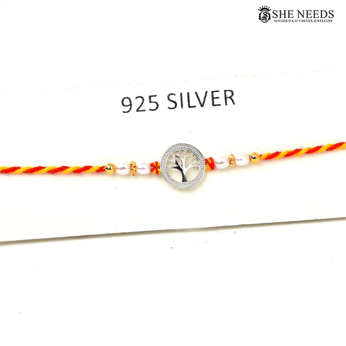 Tree of Life 925 silver Rakhi with pearl beads, sparkling stones and red-yellow braided thread|She Needs Jewellery
