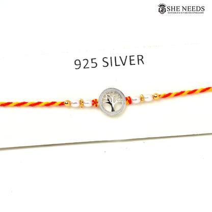 Tree of Life 925 silver Rakhi with pearl beads, sparkling stones and red-yellow braided thread|She Needs Jewellery
