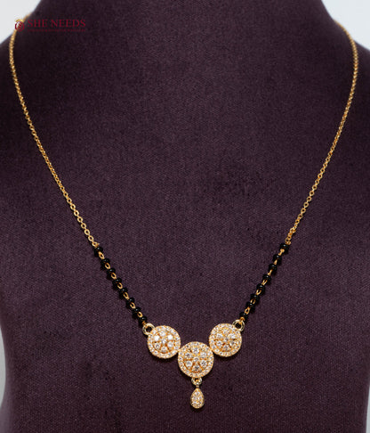 Triveni Trio American Diamond Mangalsutra Necklace with Three Floral CZ Motifs and Black Beads in Gold Plated Finish