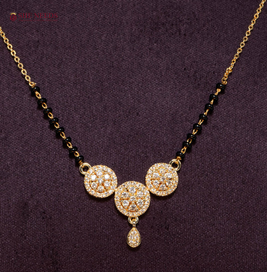 Triveni Trio American Diamond Mangalsutra Necklace with Three Floral CZ Motifs and Black Beads in Gold Plated Finish