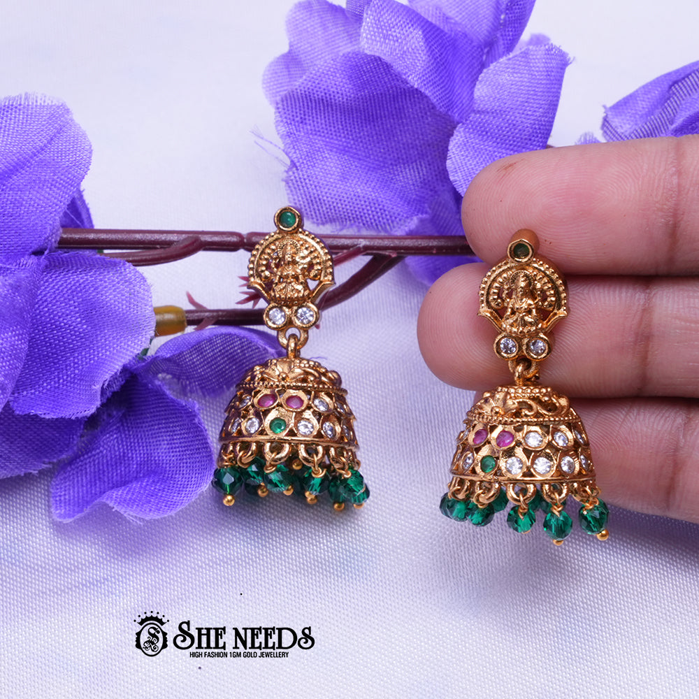Temple Lakshmi gold jhumka earrings with Green stones and bead drops by She Needs Jewellery