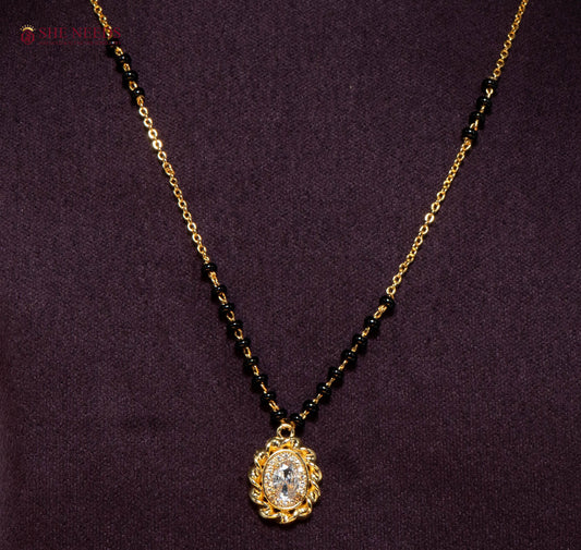 Vaishnavi Oval American Diamond Mangalsutra Necklace with Oval CZ Pendant and Black Beads in Gold Plated Finish