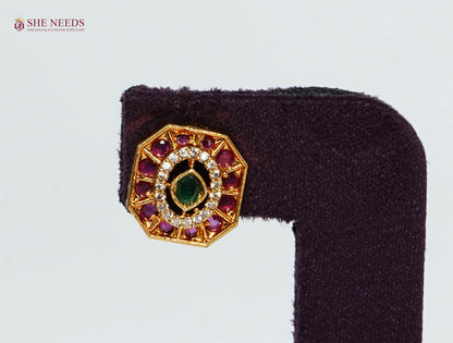 Gold-plated octagonal stud earring with ruby, emerald-inspired center stone, and American Diamond detailing..|She Needs Jewellery
