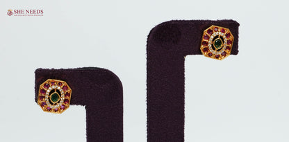 Pair of gold-plated octagonal stud earrings featuring ruby and emerald-inspired stones with sparkling American Diamonds.|She Needs Jewellery
