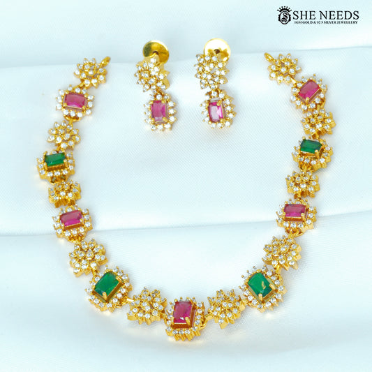 Zivara multicolor ruby and emerald necklace set with matching earrings and white stone floral detailing
|She Needs Jewellery