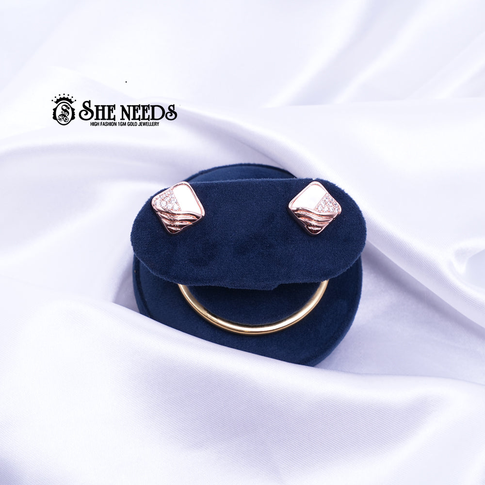 ROSE GOLD WAVE STUDS